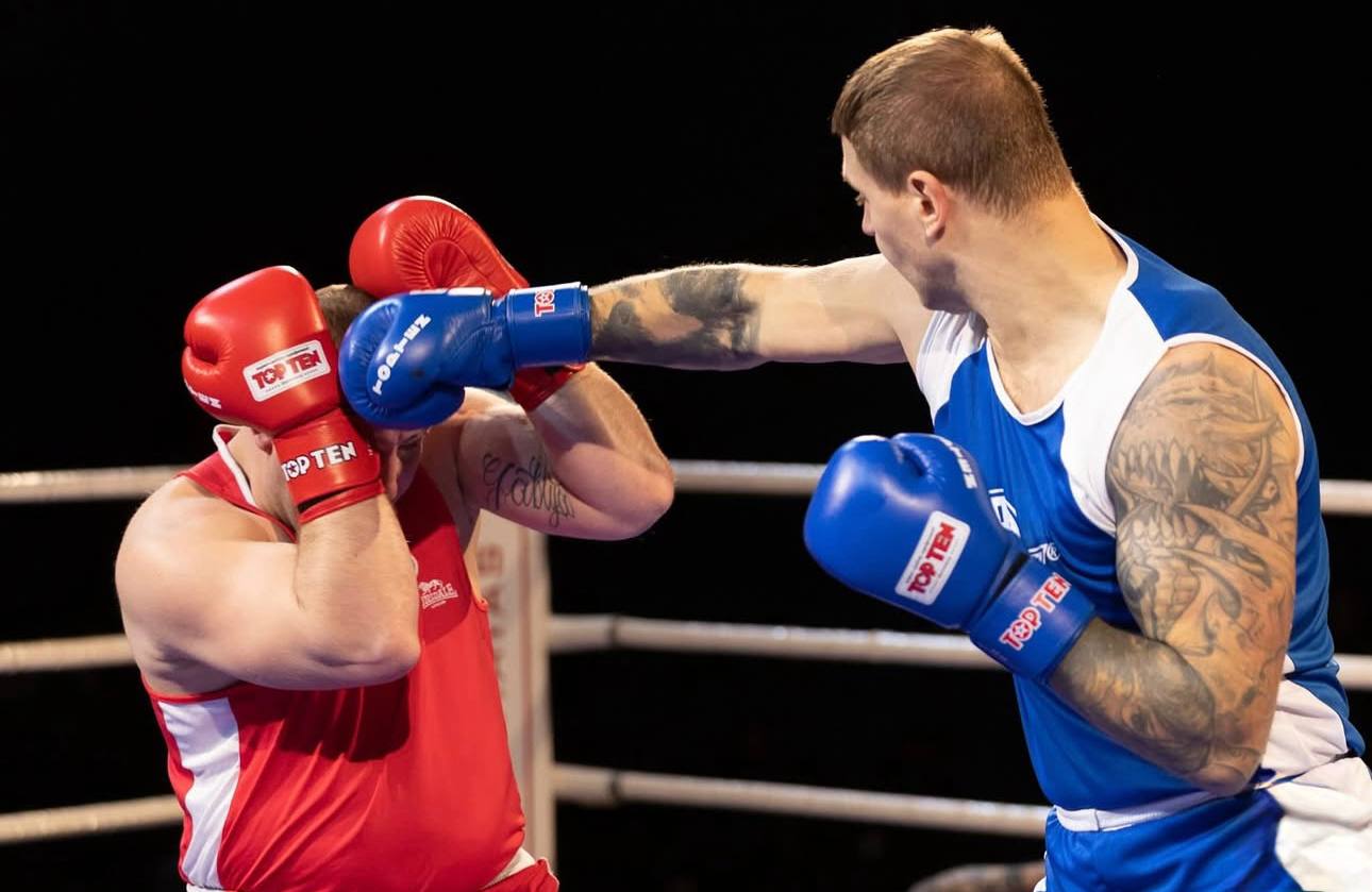 Precision punch during training with blue gloves in Dubai